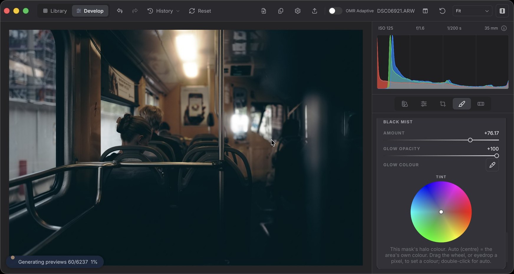 OhMyRAW developing a dim tram interior: the ceiling lamp blooms softly while the handrails stay sharp, with a mask's Black Mist controls open
